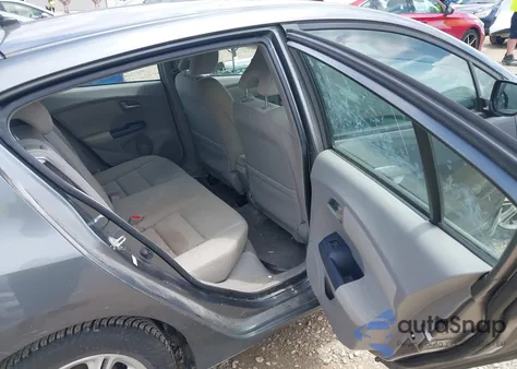 2010 Honda Insight Ex z USA, uszkodzony, nr VIN JHMZE2H71AS008487